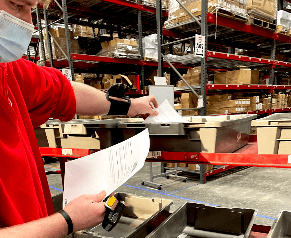 Corey organizing order shipment paper