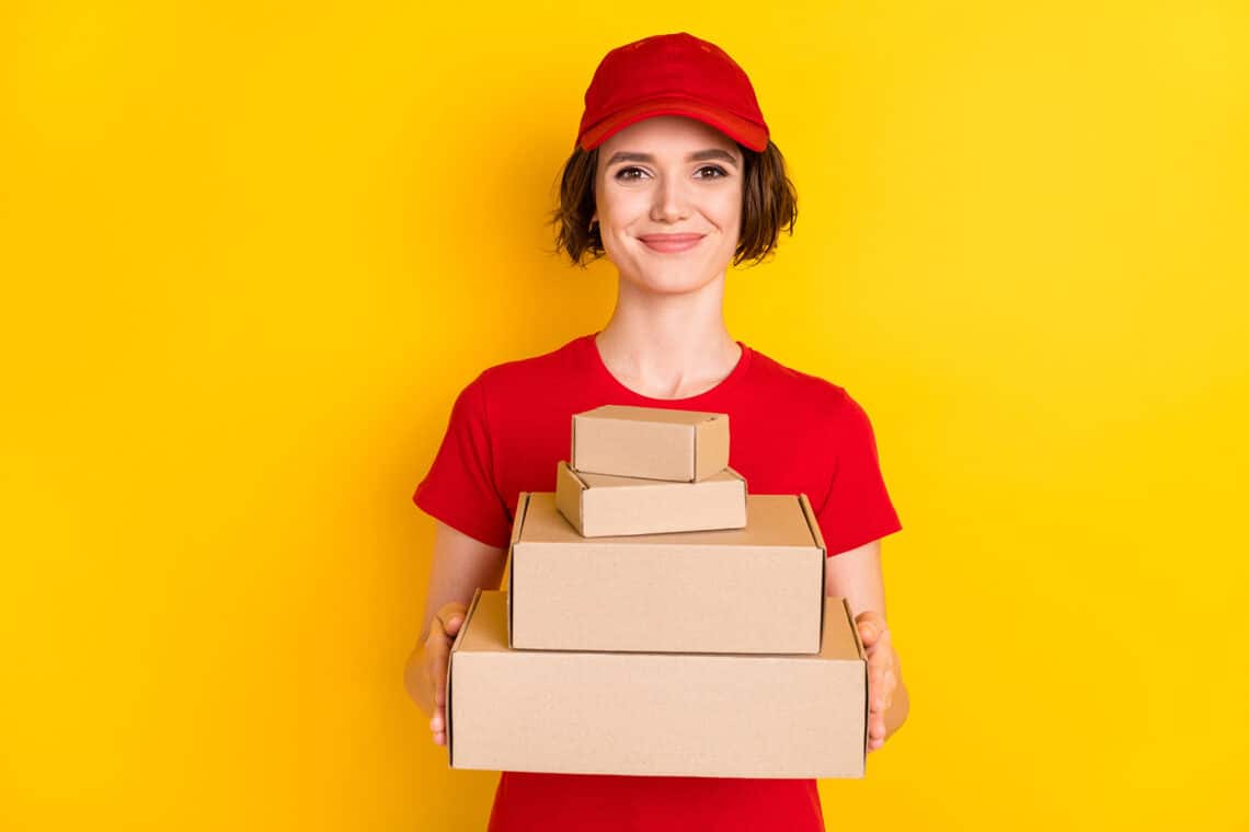 eCommerce woman holding varying sizes of boxes