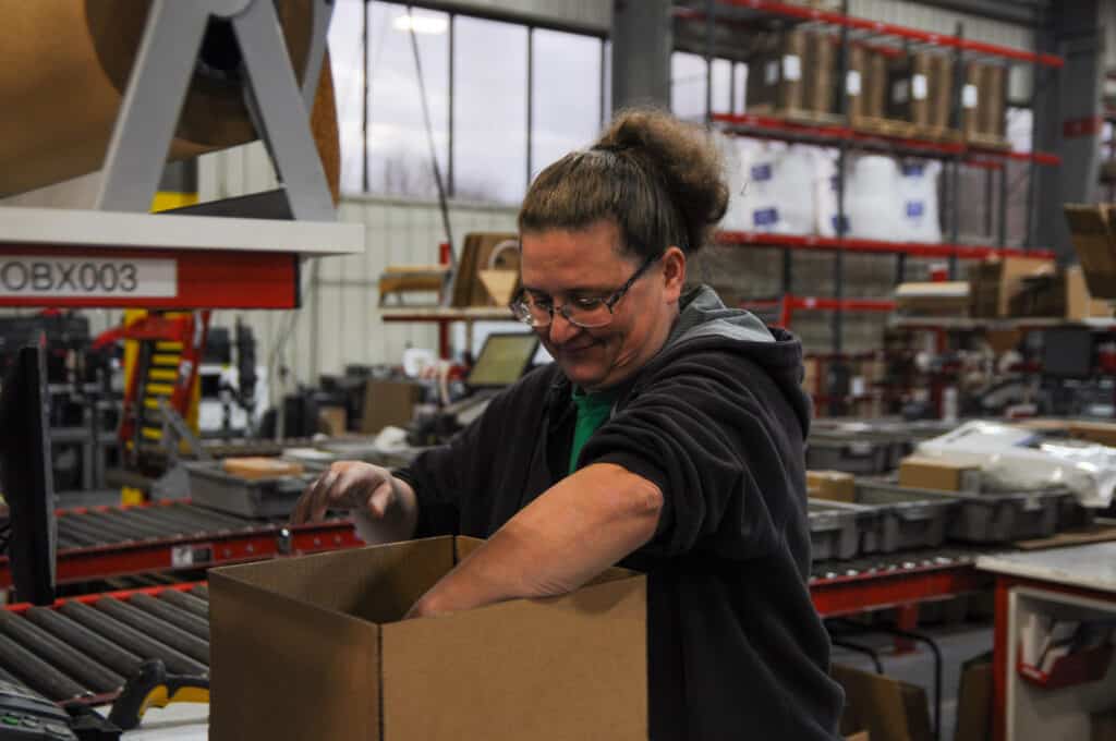 warehouse worker filling a Shopify request fulfillment order